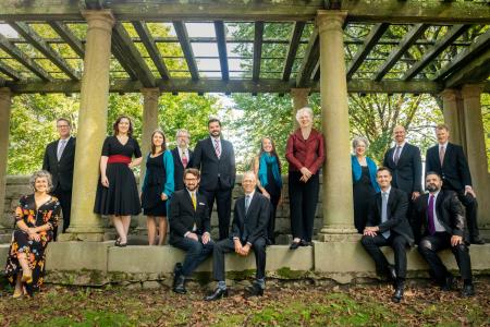 Blue Heron ensemble members posing in a park