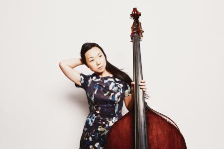 Linda May Han Oh posing with an upbright bass