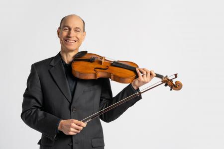 Lawrence Neuman poses with his viola.