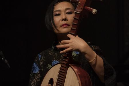 Woman playing strings instrument