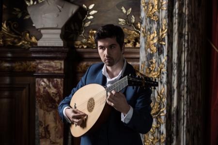 A man playing a lute