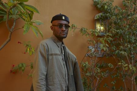  Isaiah Collier against a yellow wall