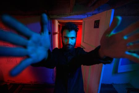  Tigran Hamasyan solo picture in a room filled with neon lights