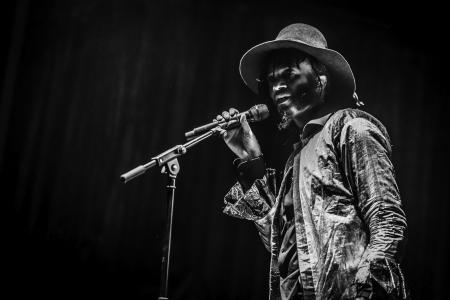 Fantastic Negrito singing on stage