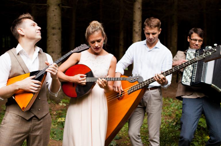 Russian Renaissance with balalaikas, domra, and button accordion in forest