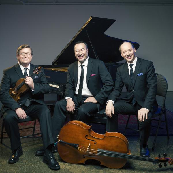 The Montrose Trio sitting with instruments