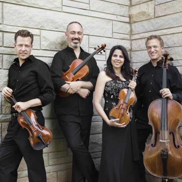 Pacifica Quartet against white stone wall