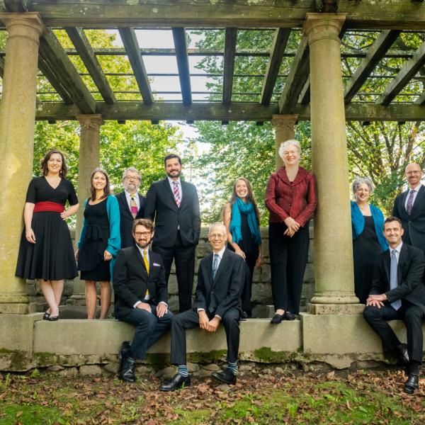 Blue Heron ensemble members posing in a park