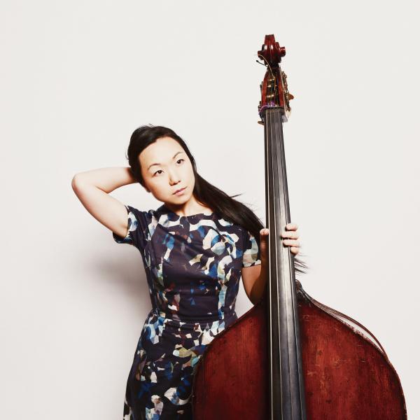 Linda May Han Oh posing with an upbright bass