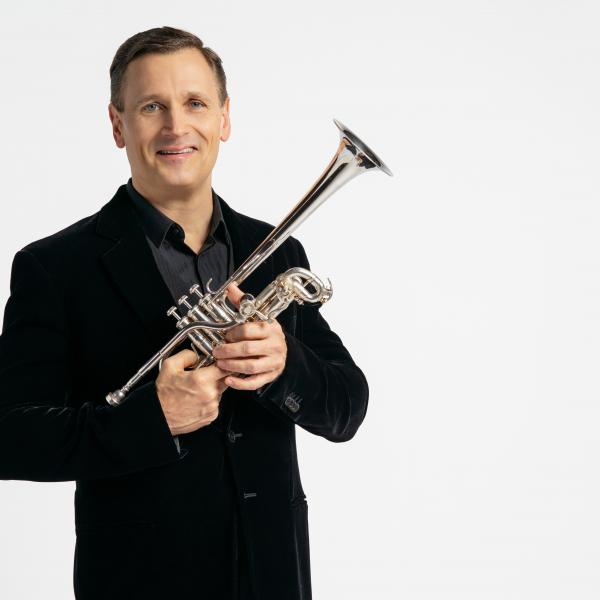 John Hagstrom poses with his trumpet.