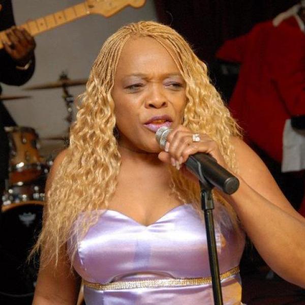 A woman singing into a microphone