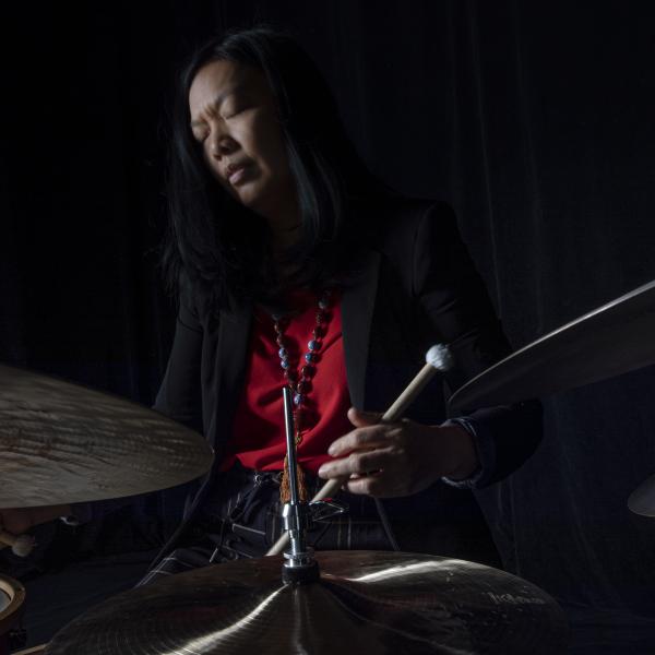 A woman playing the drums