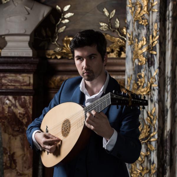 A man playing a lute