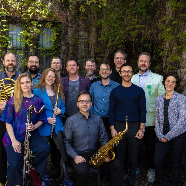 The Grossman Ensemble poses among foliage.